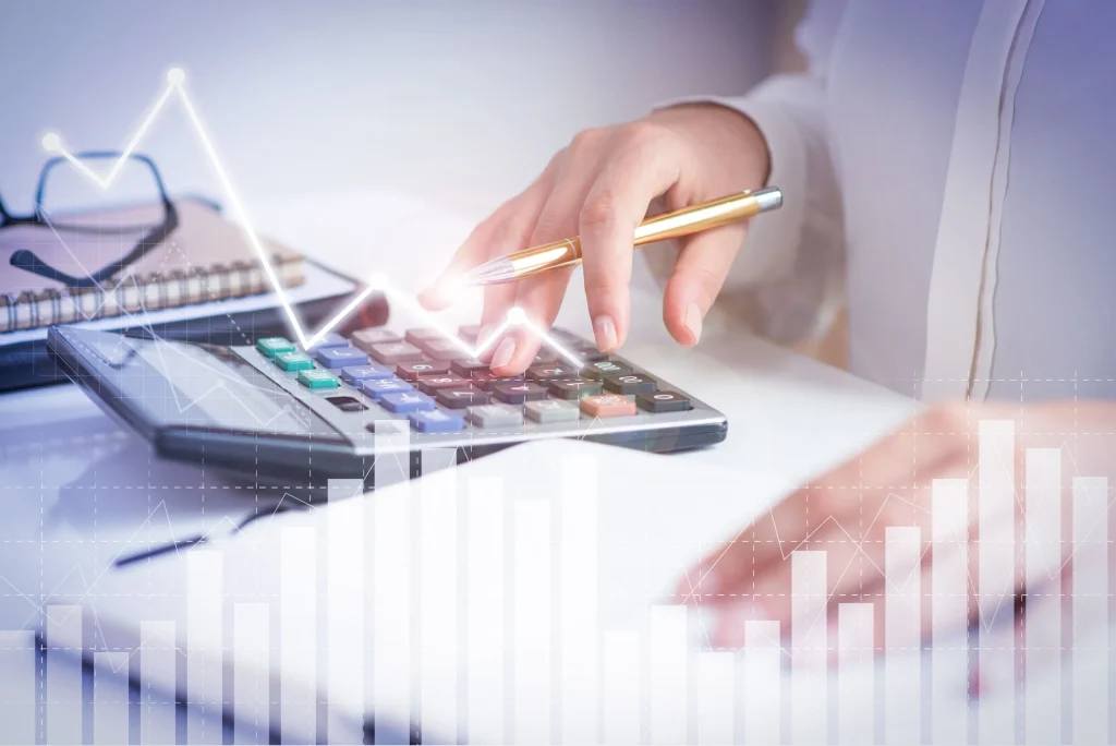 accountant calculating profit with financial analysis graphs 1 scaled 1